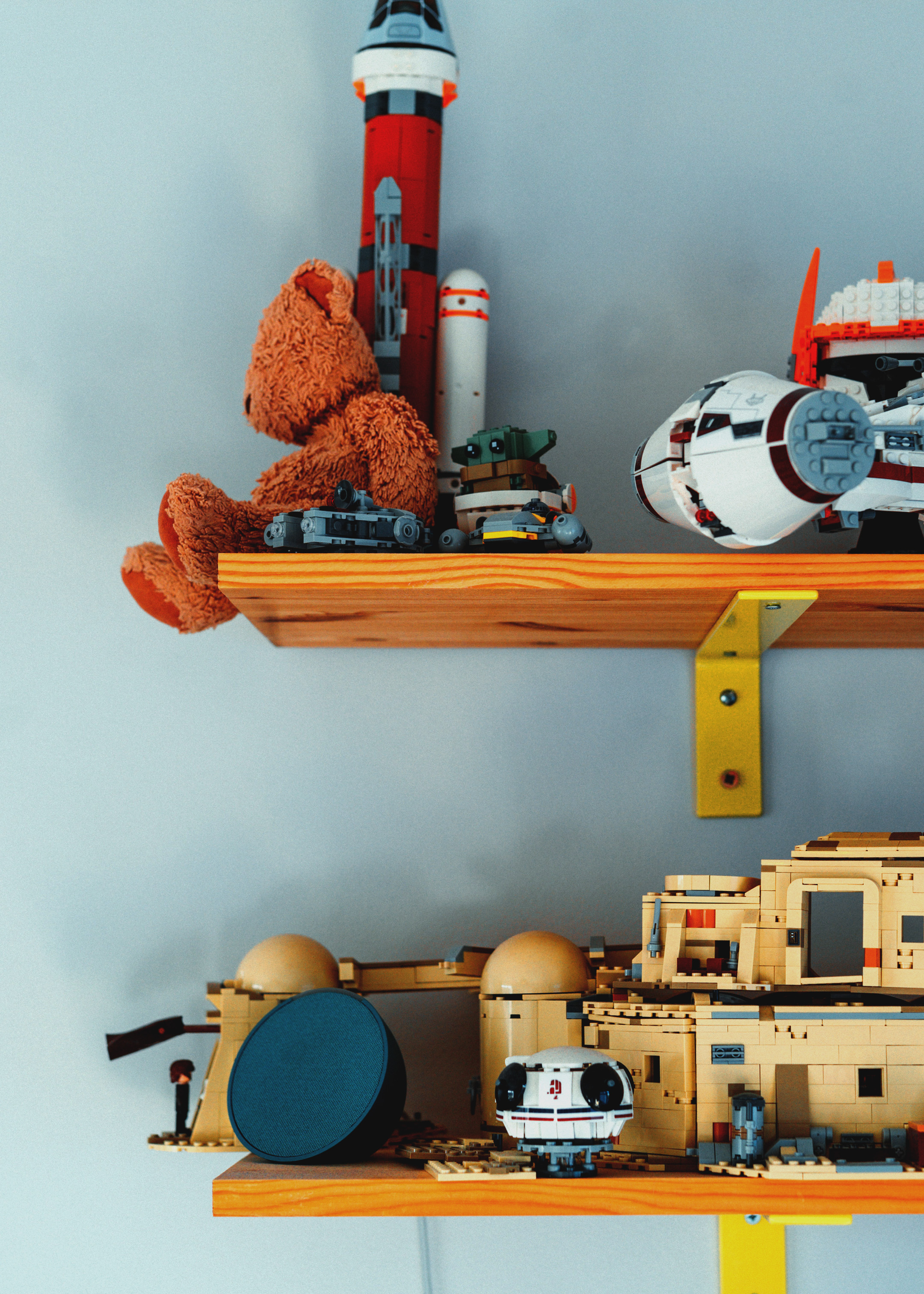 Toys on a wooden shelf.