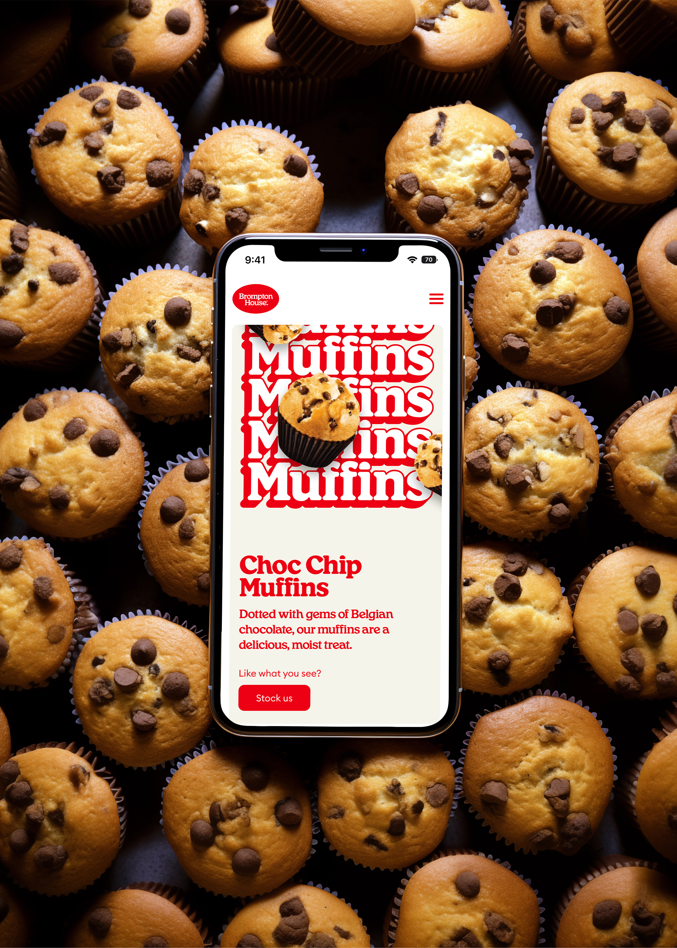 A phone open on the Choc Chip Muffins website page resting on a bed of many Brompton House Choc Chip Muffins
