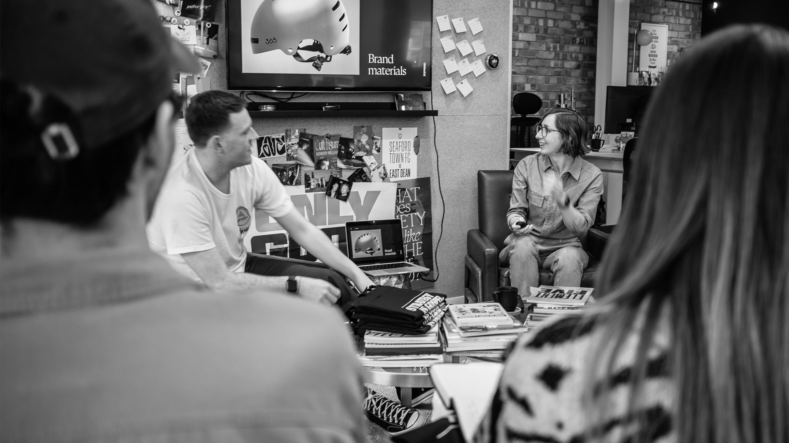 Brand designers giving a talk about employer brand strategy to a team of designs students