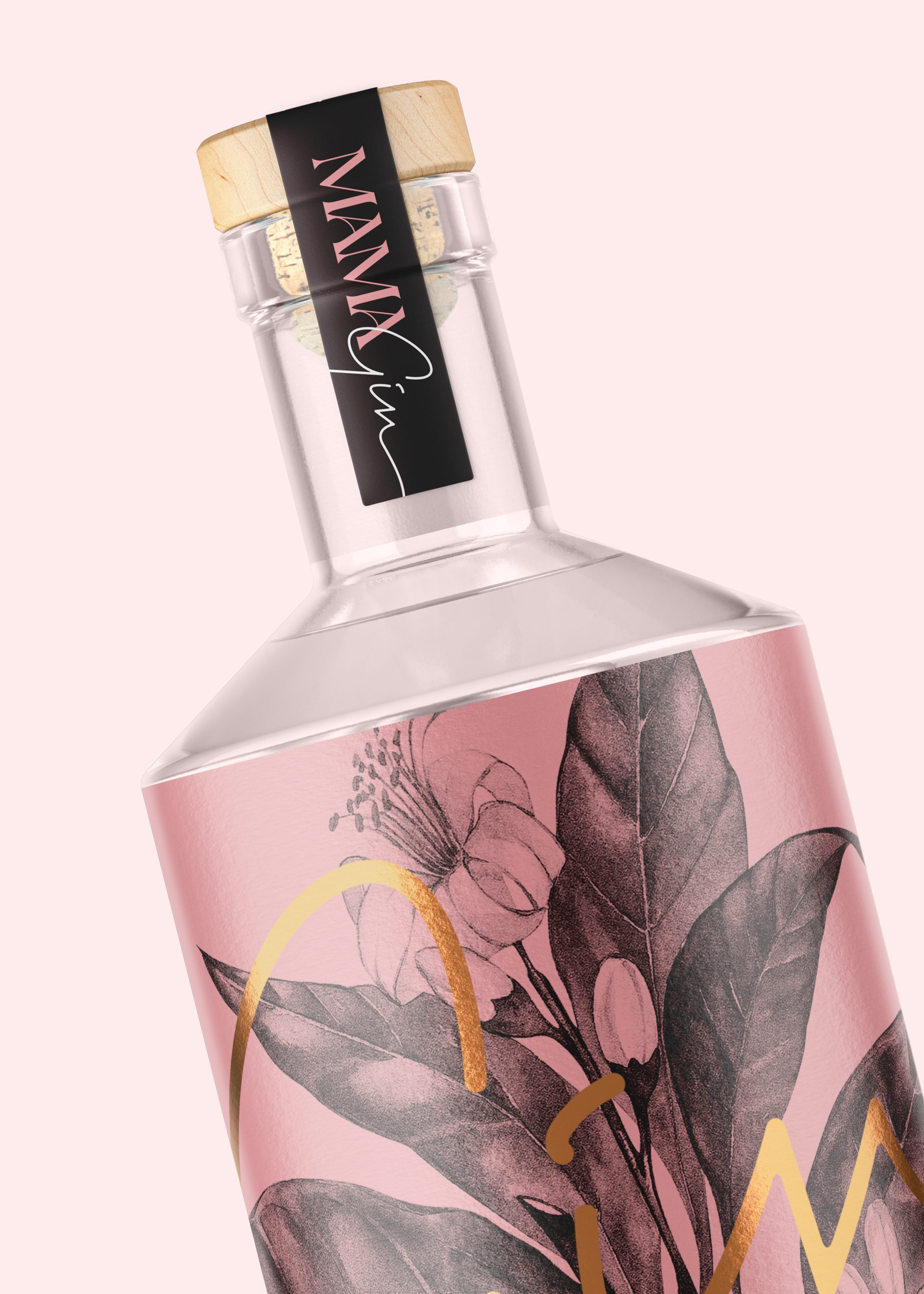 A Mama Gin bottle with cork cap and a cover featuring a greyscale drawing of some flowers behind the cursive word 'Gin' in large gold letters