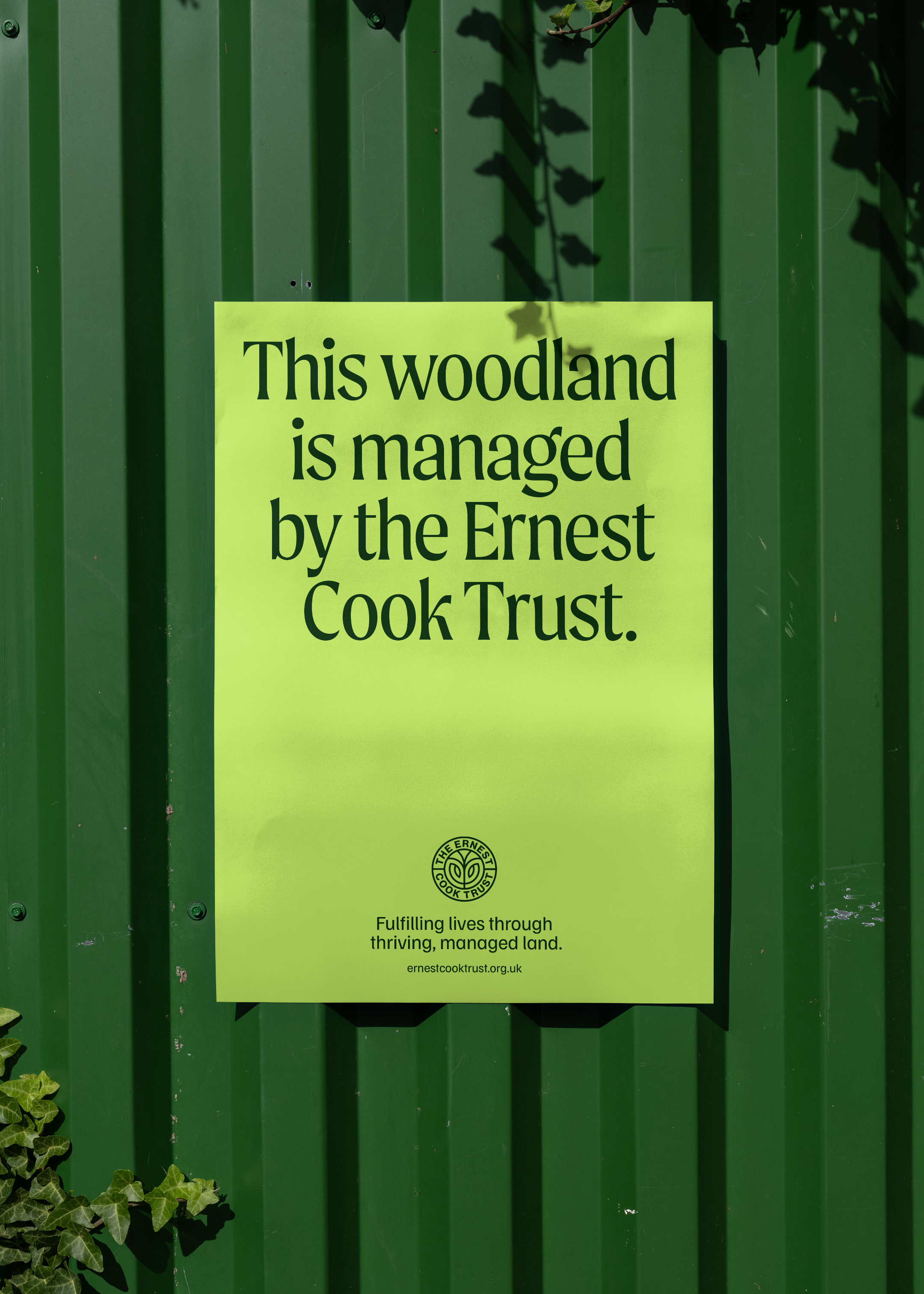 Fence sign saying that the woodland is managed by the Ernest Cook Trust