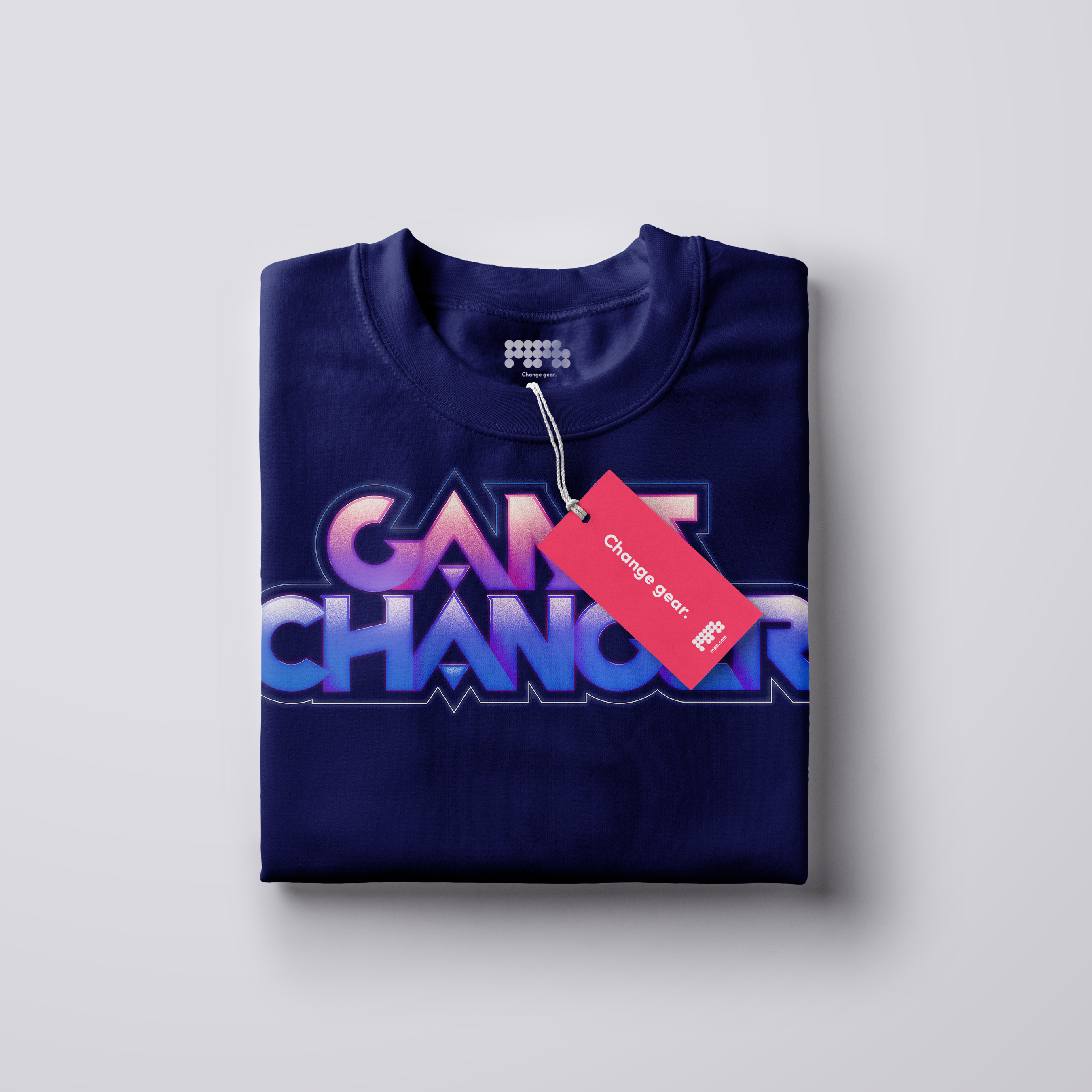 A blue folded t-shirt with the words 'Game Changer' in a bold gamer-style font