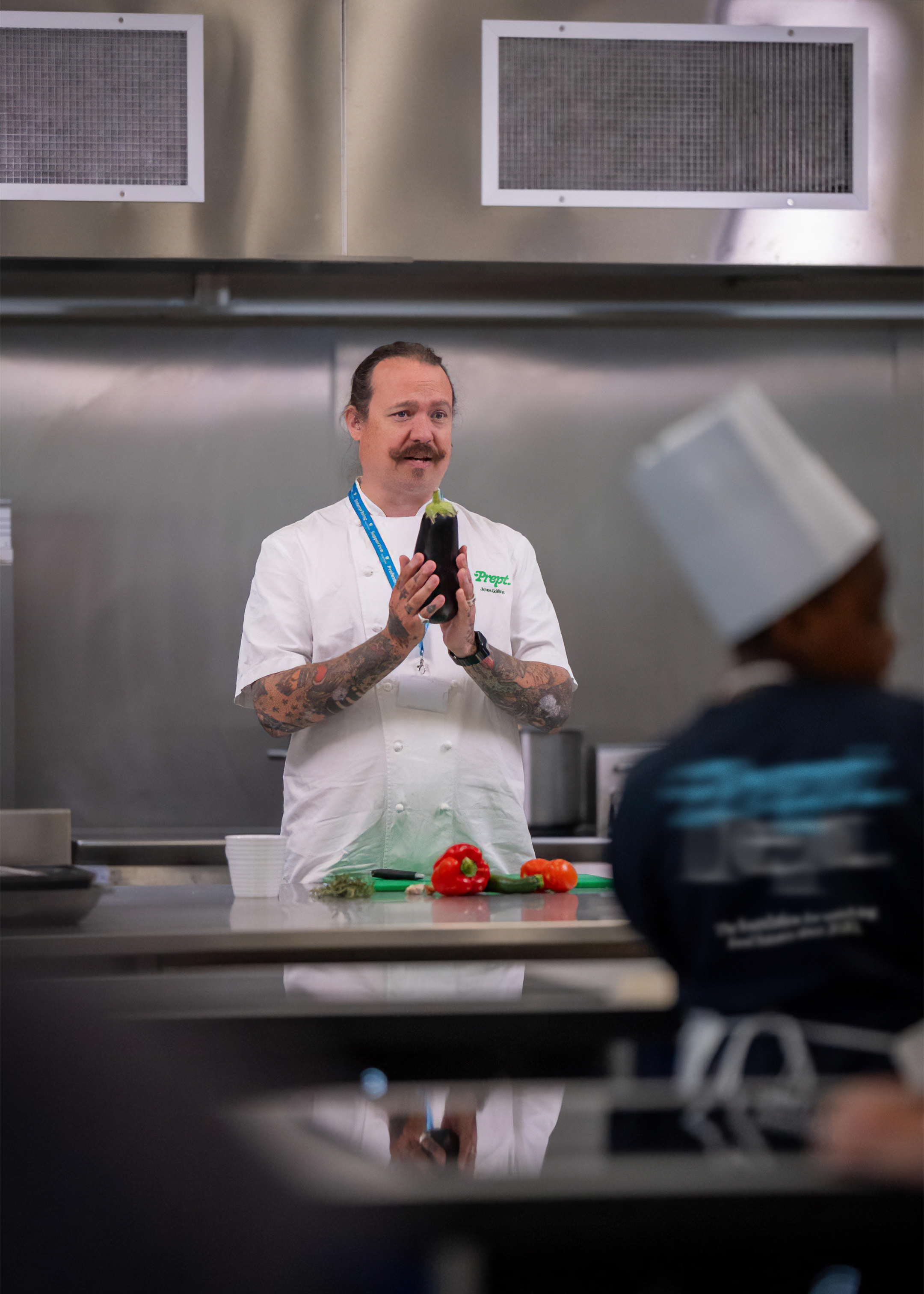 Chef wearing prept jacket teaching