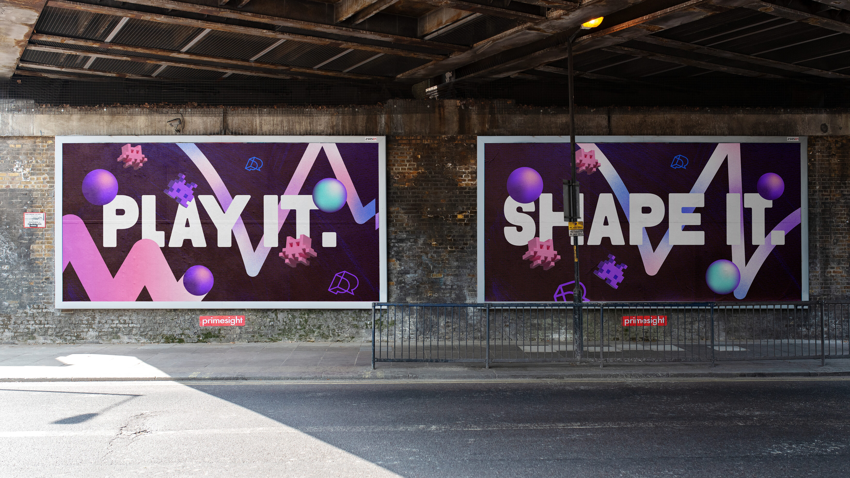 play it shape it landscape posters on underpass brick wall