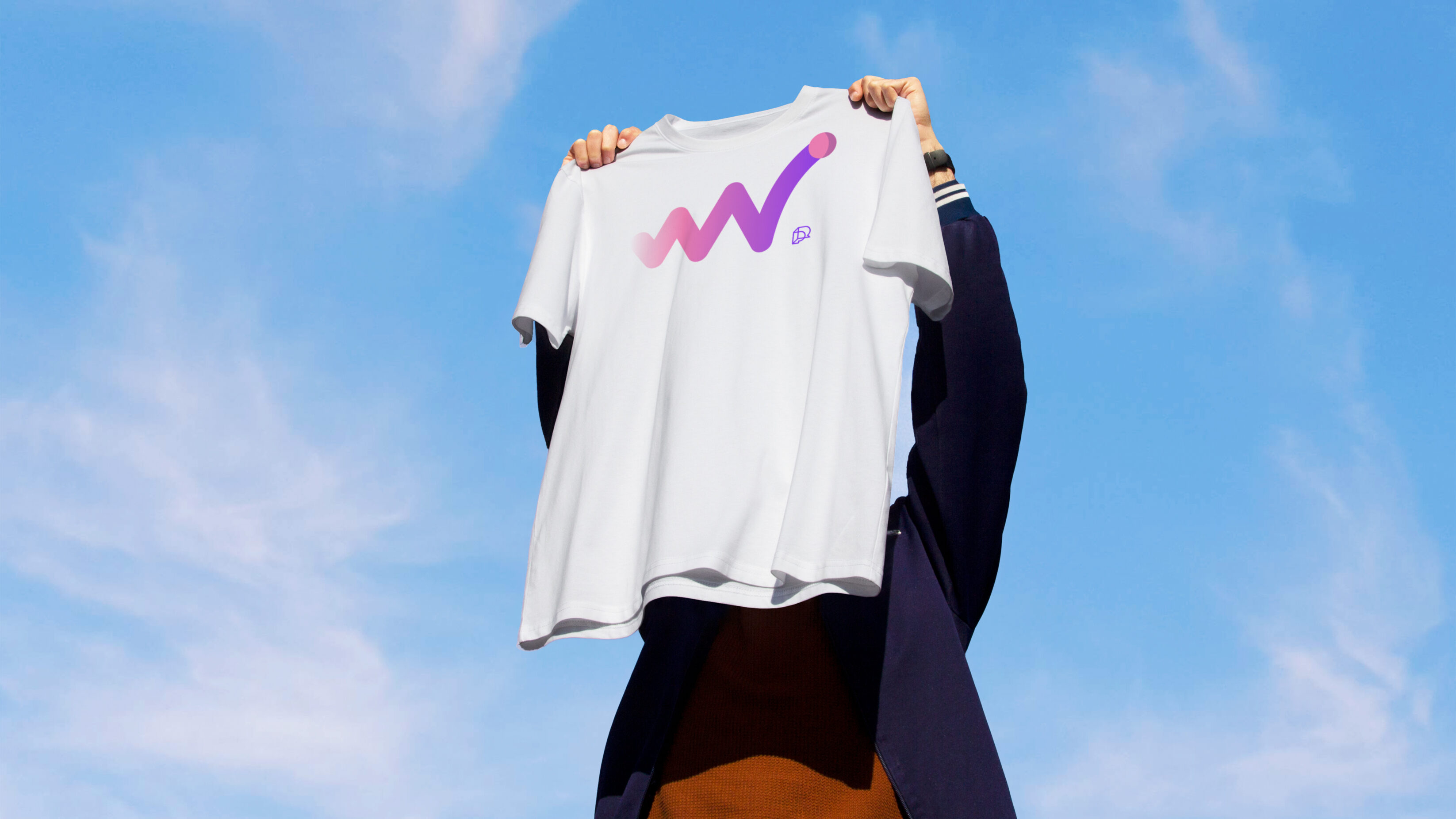 player research white t-shirt featuring game graphic being held in front of blue sky