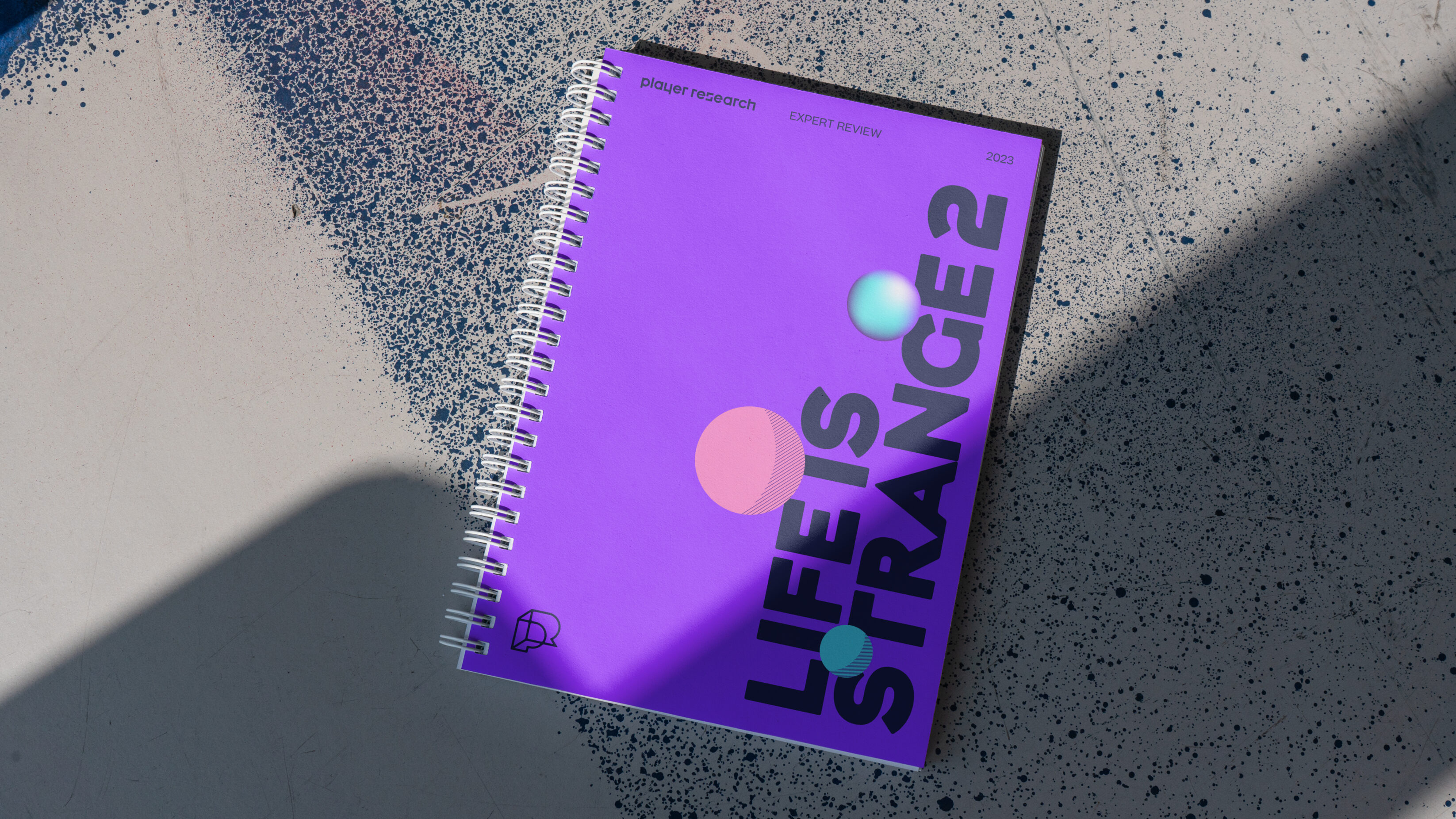purple player research notebook on concrete surface