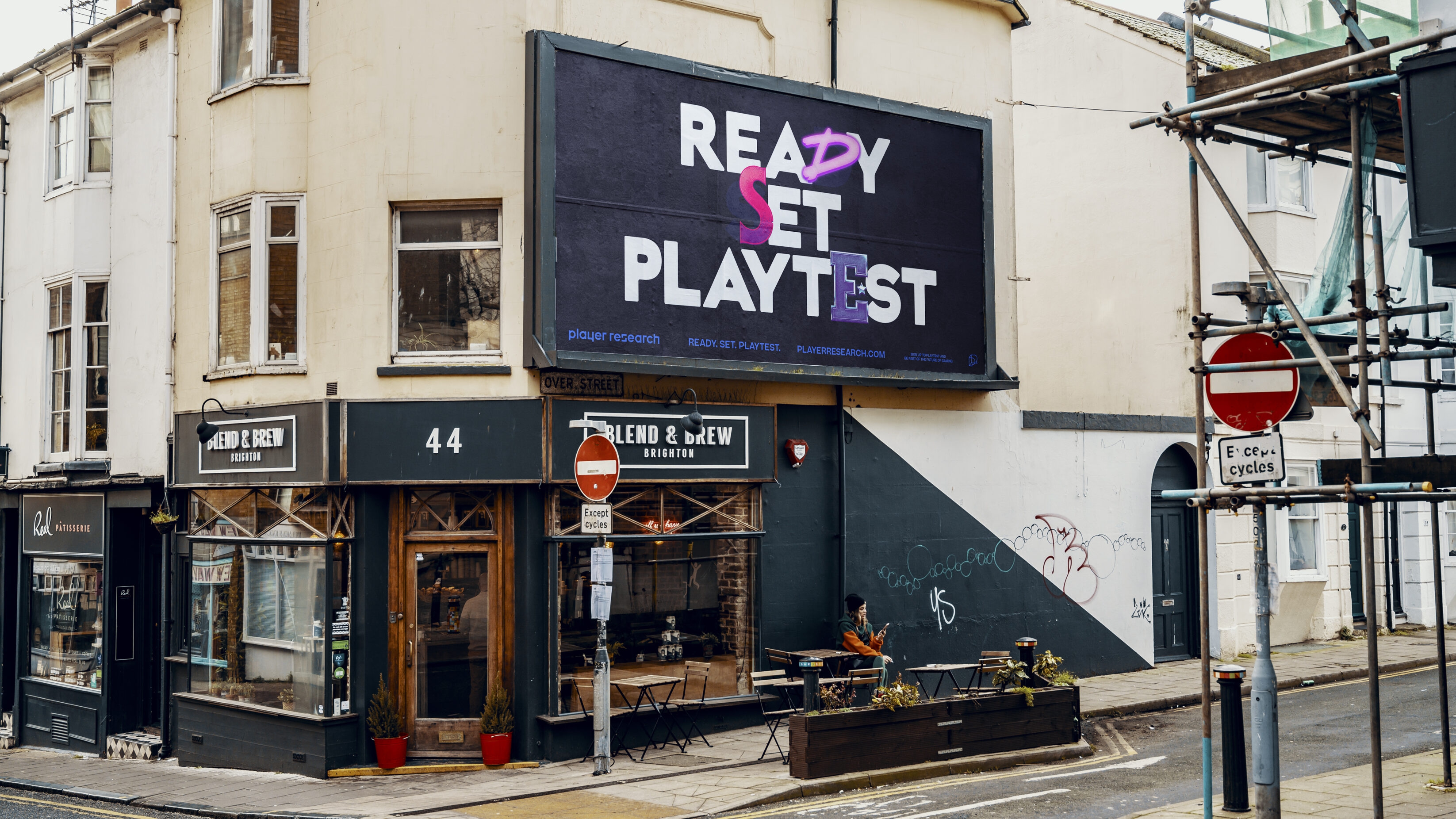 Ready. Set. Playtest. type bollboard above a Brighton cafe