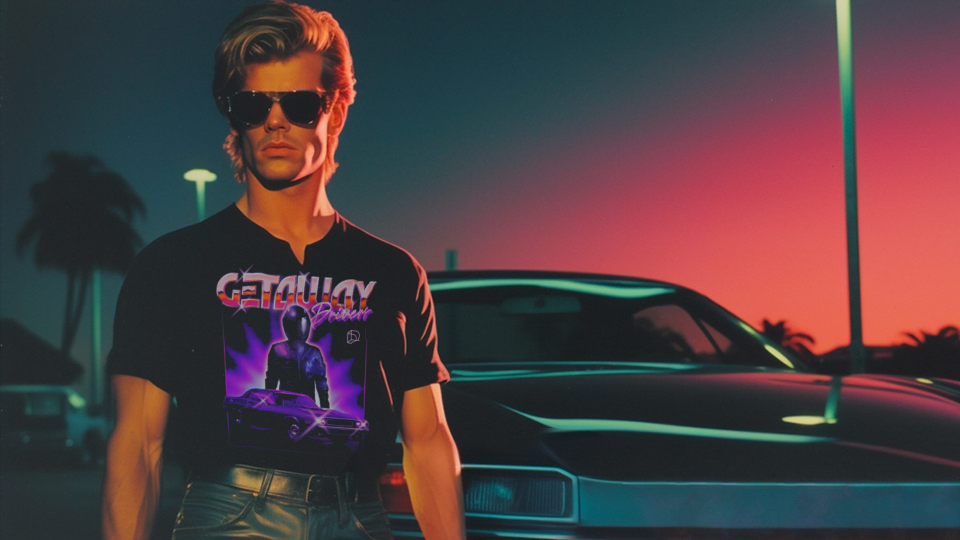 Cool late 20's man wring a Getaway Drive t-shirt, standing in front of a sports car