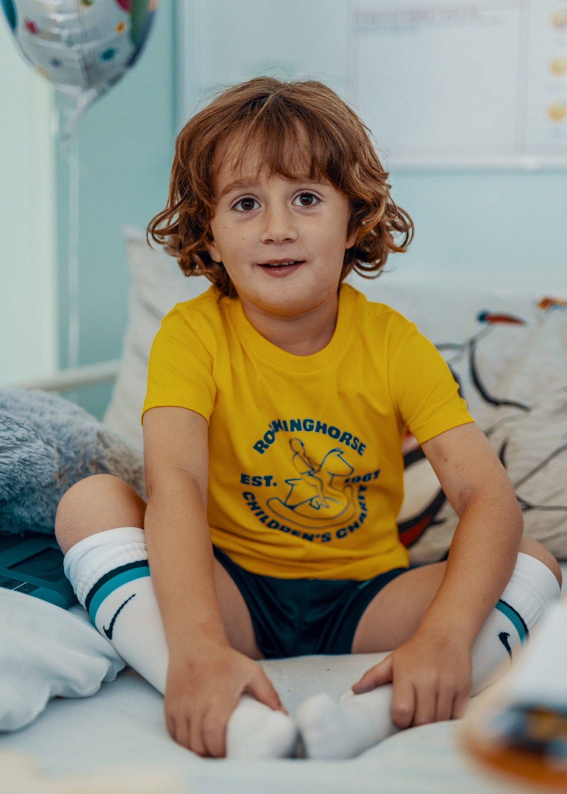 Kid in the rockinghorse tshirt