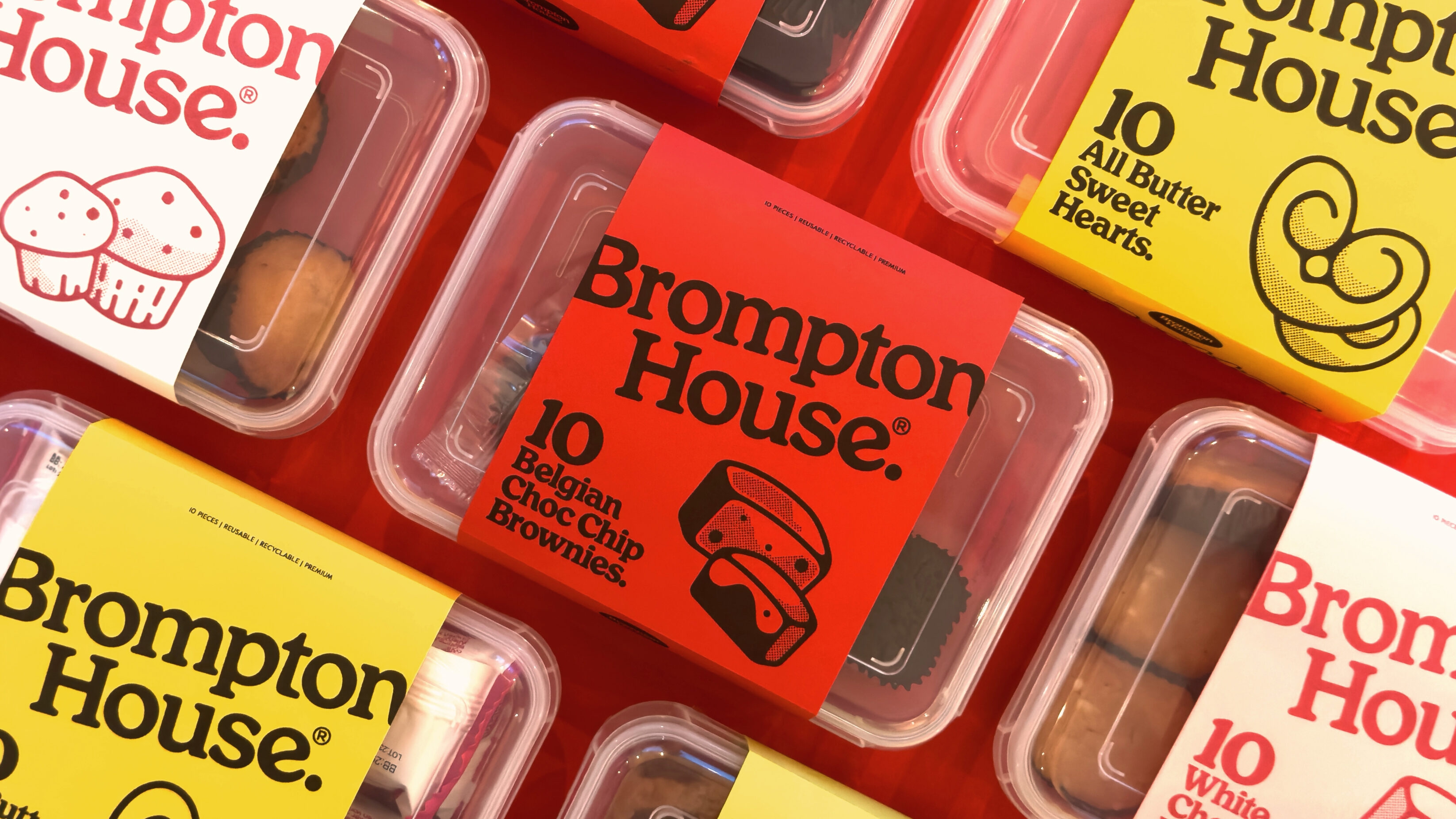 Boxed sweet treats with their corresponding colours like black on yellow for All Butter Sweet Hearts