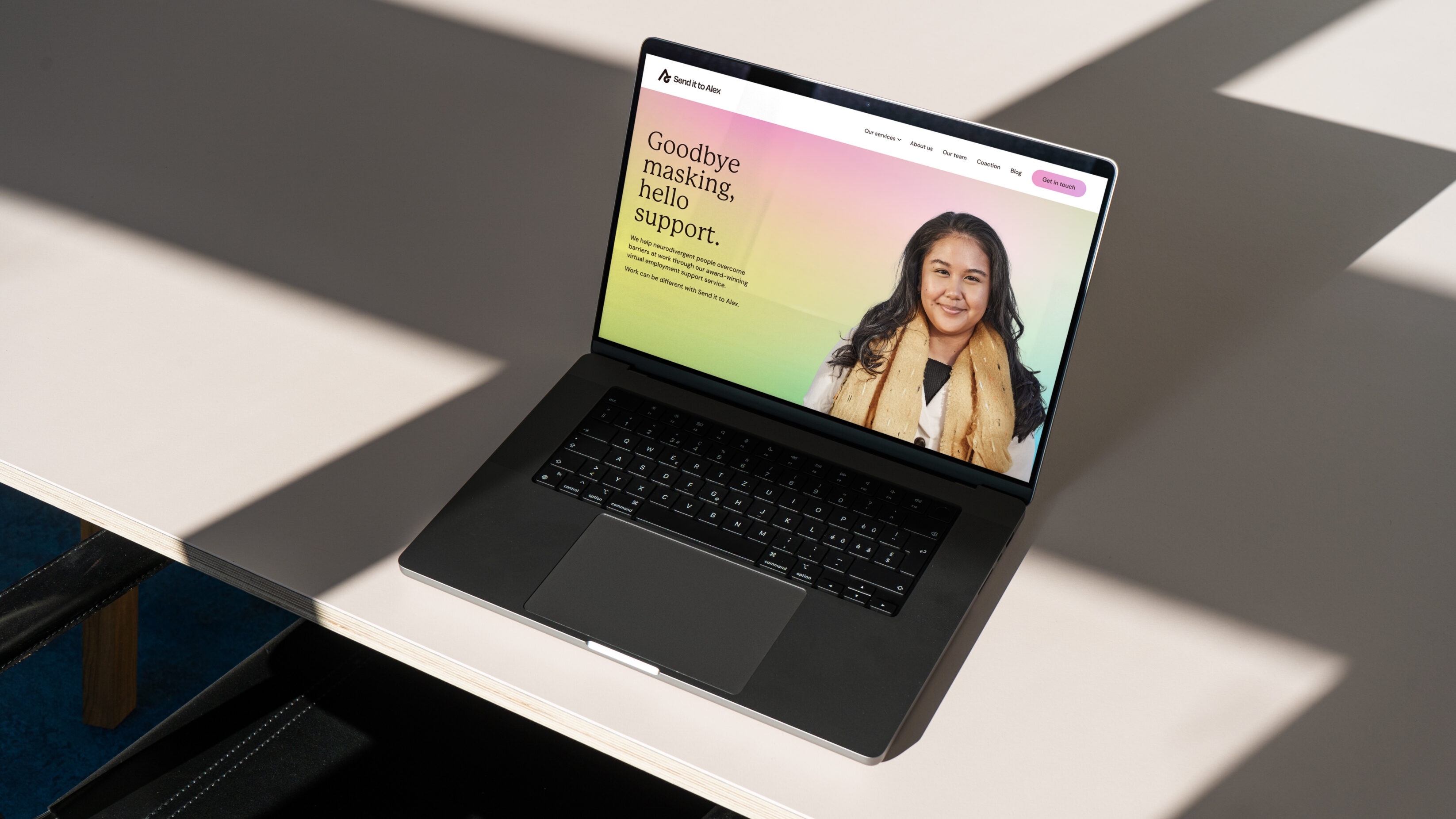 laptop showing the hero image and messaging on the website.