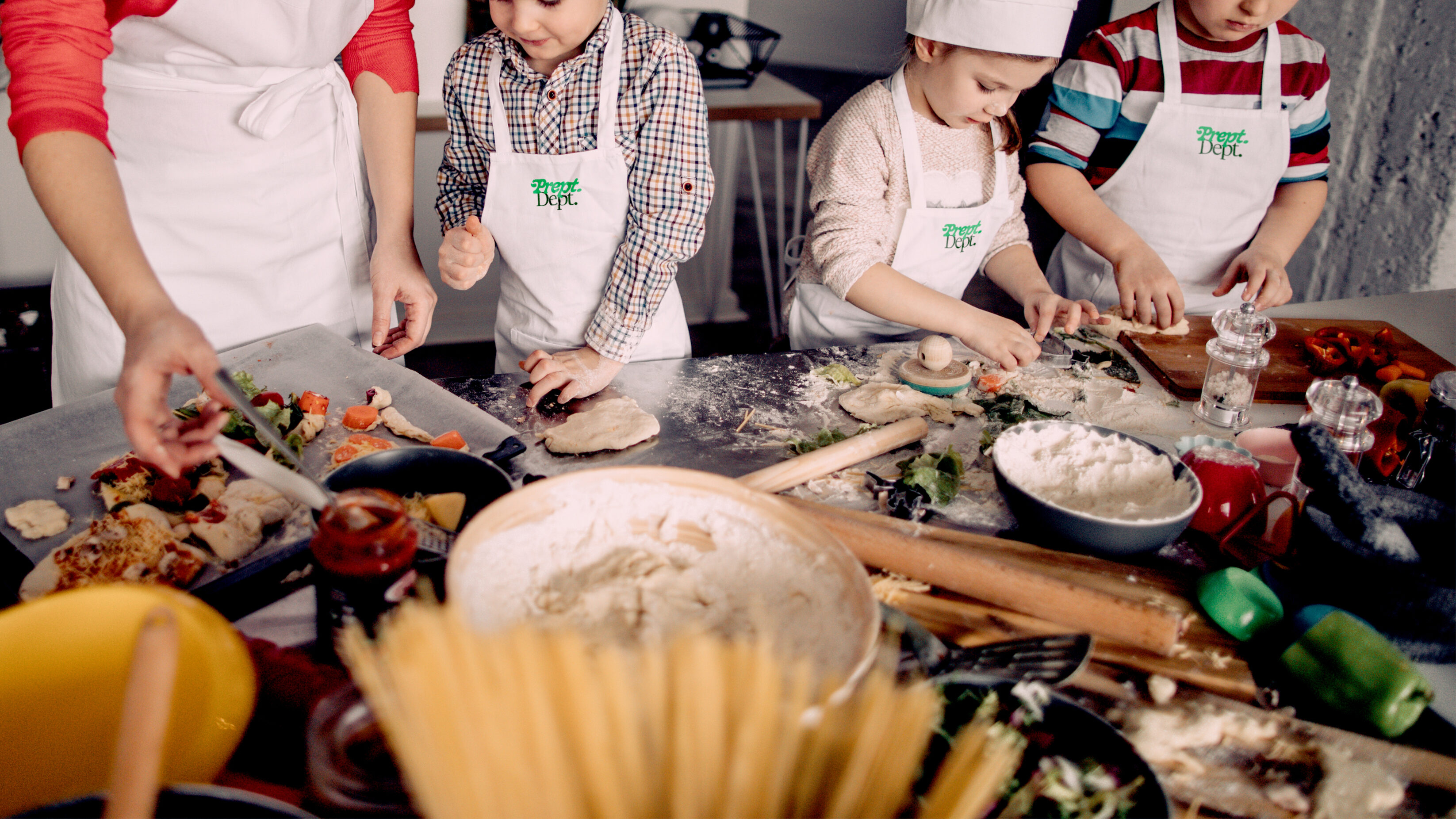 Kids in prept aprons cooking