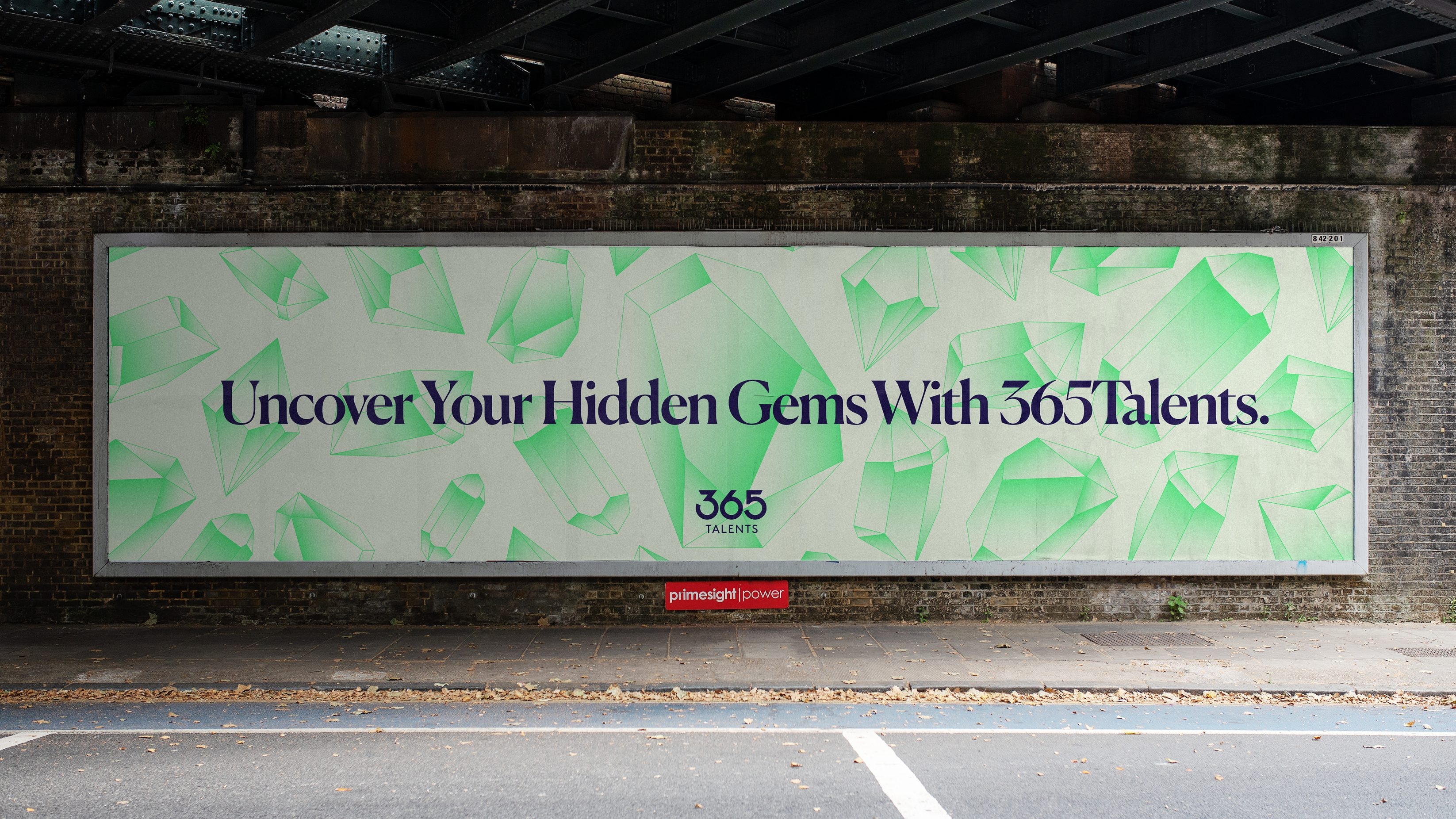 An underpass billboard with the message 'Uncover Your Hidden Gems With 365Talents'.