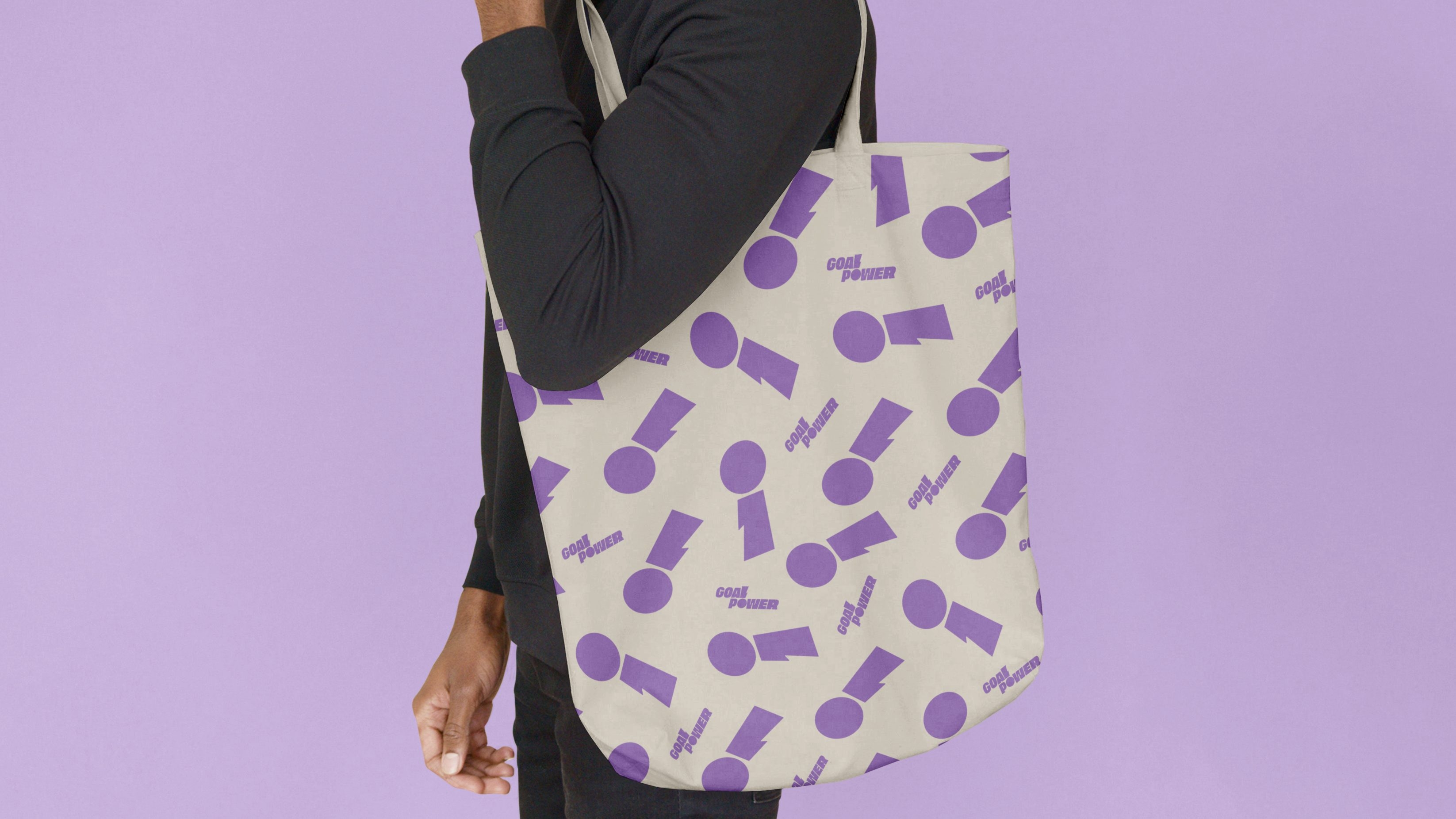 Stylised purple Goal Power branded exclamation marks on a white tote bag