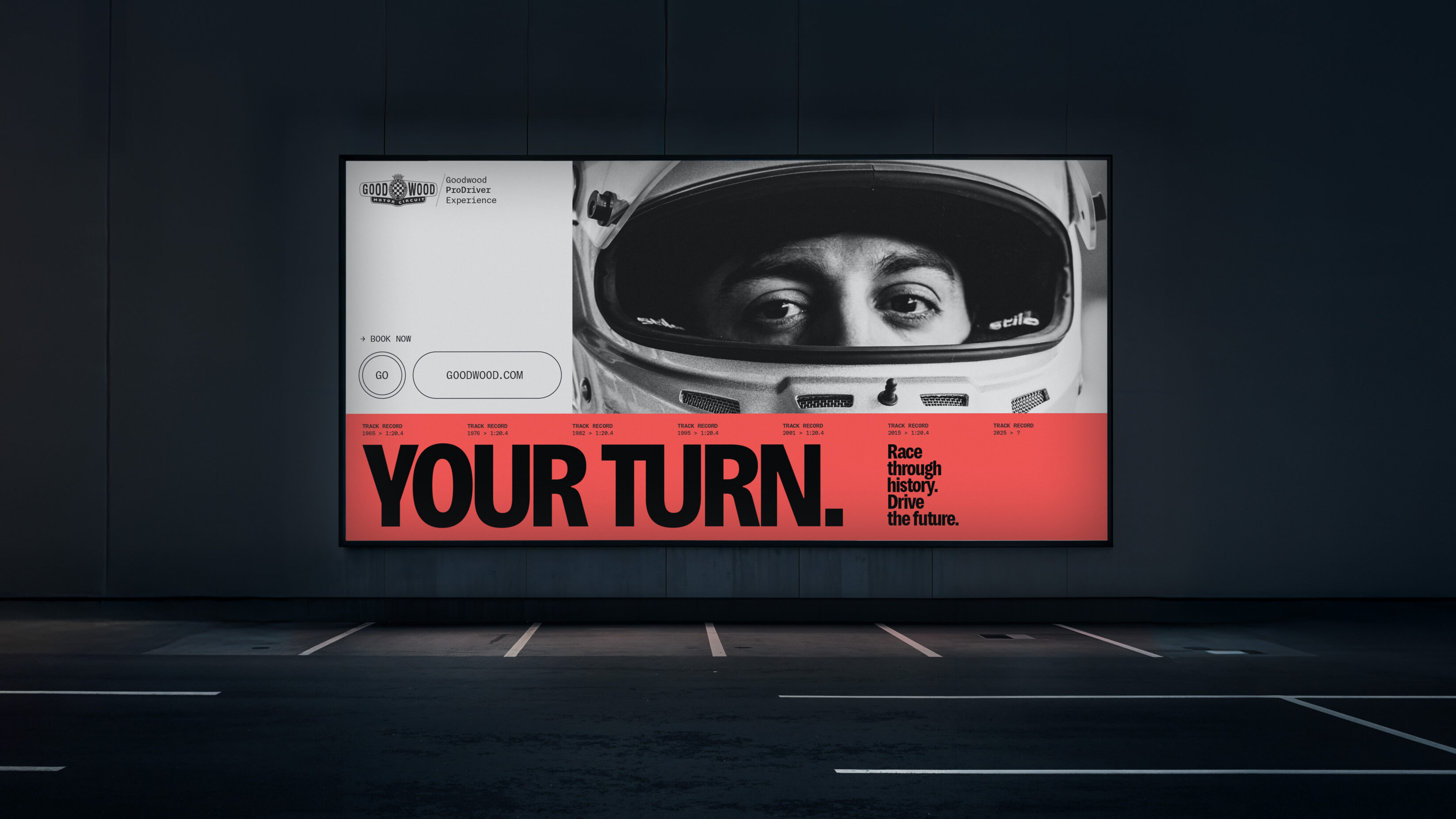 Billboard poster of the Goodwood ProDriver experience advertising. It shows a closeup of a racing drivers eyes and the ad campaign copy - Your Turn.