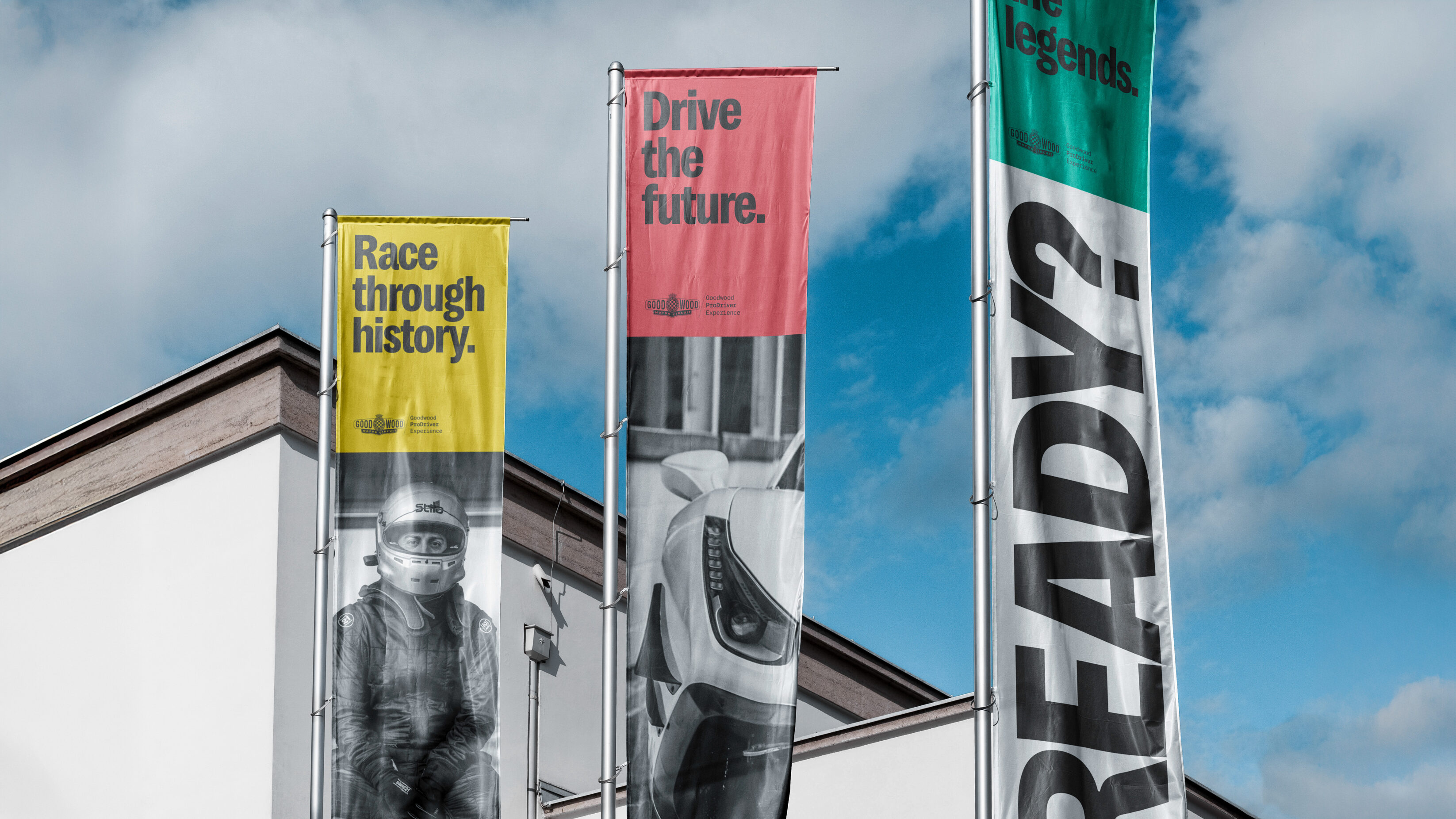 Flags showing the brand ad messaging with photos of a driver and fast car.