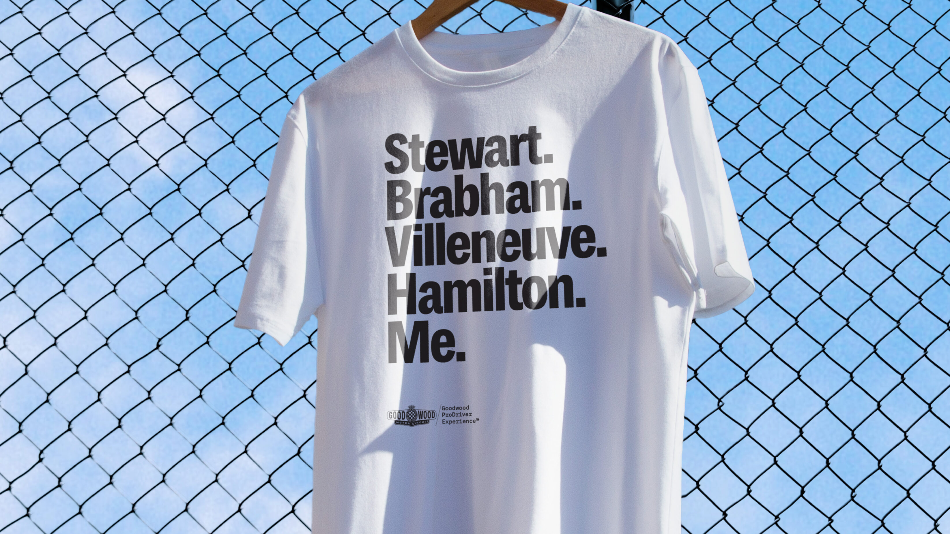 White t-shirt with four Formula One world champions listed, with the word 'Me.' at the bottom