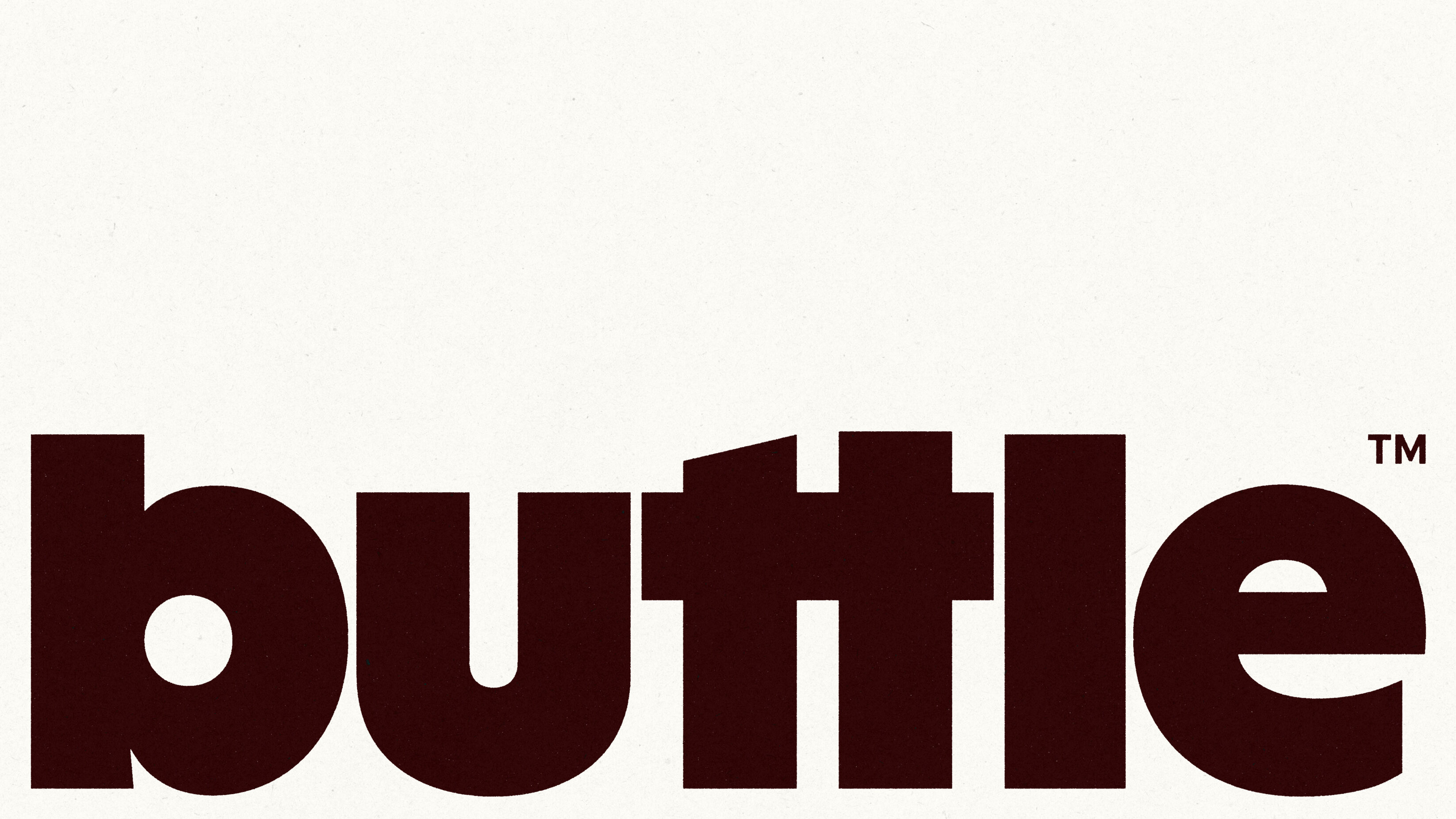 A large Buttle logo on a light cream background