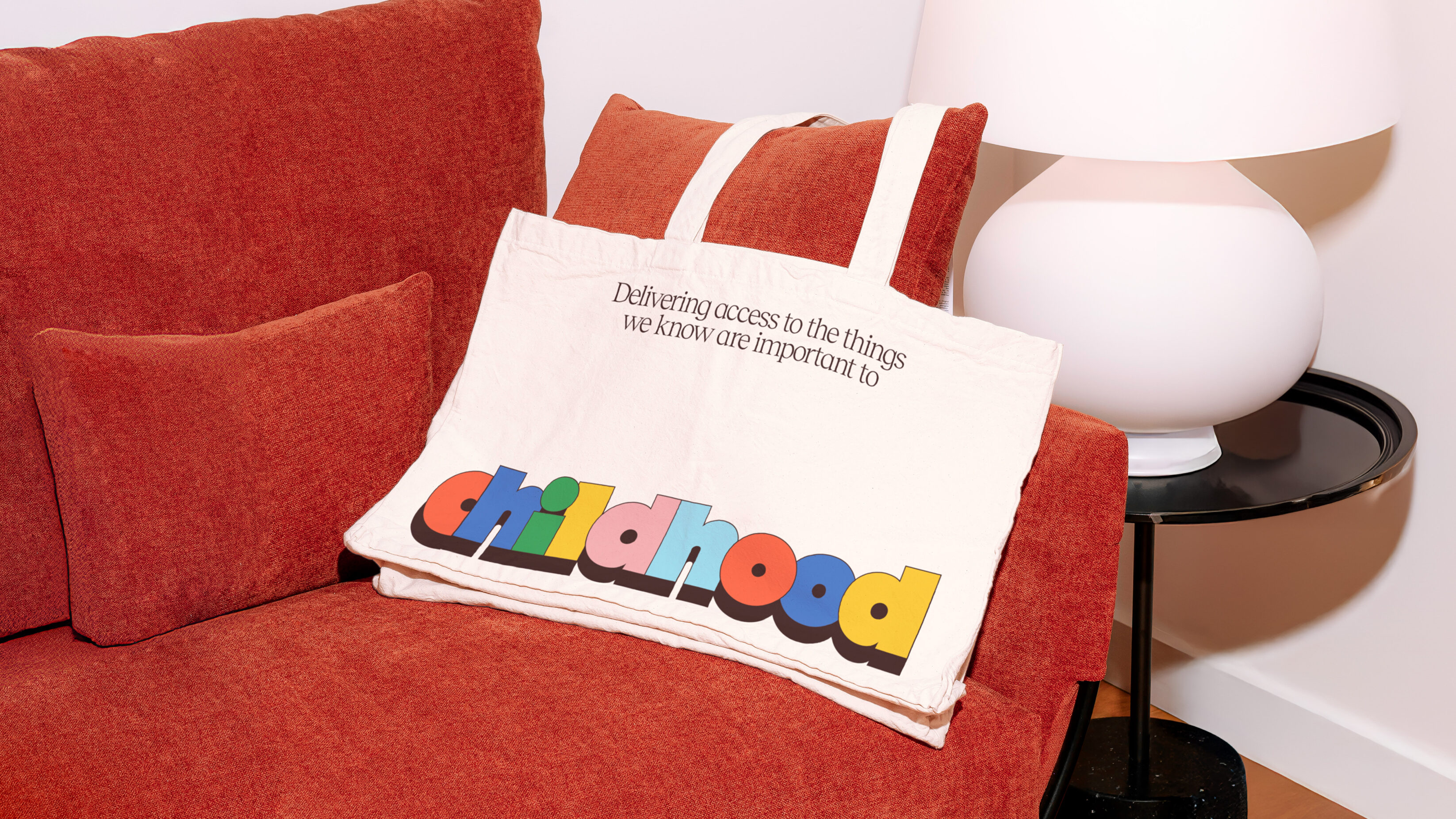 Buttle tote bag laying on a sofa.