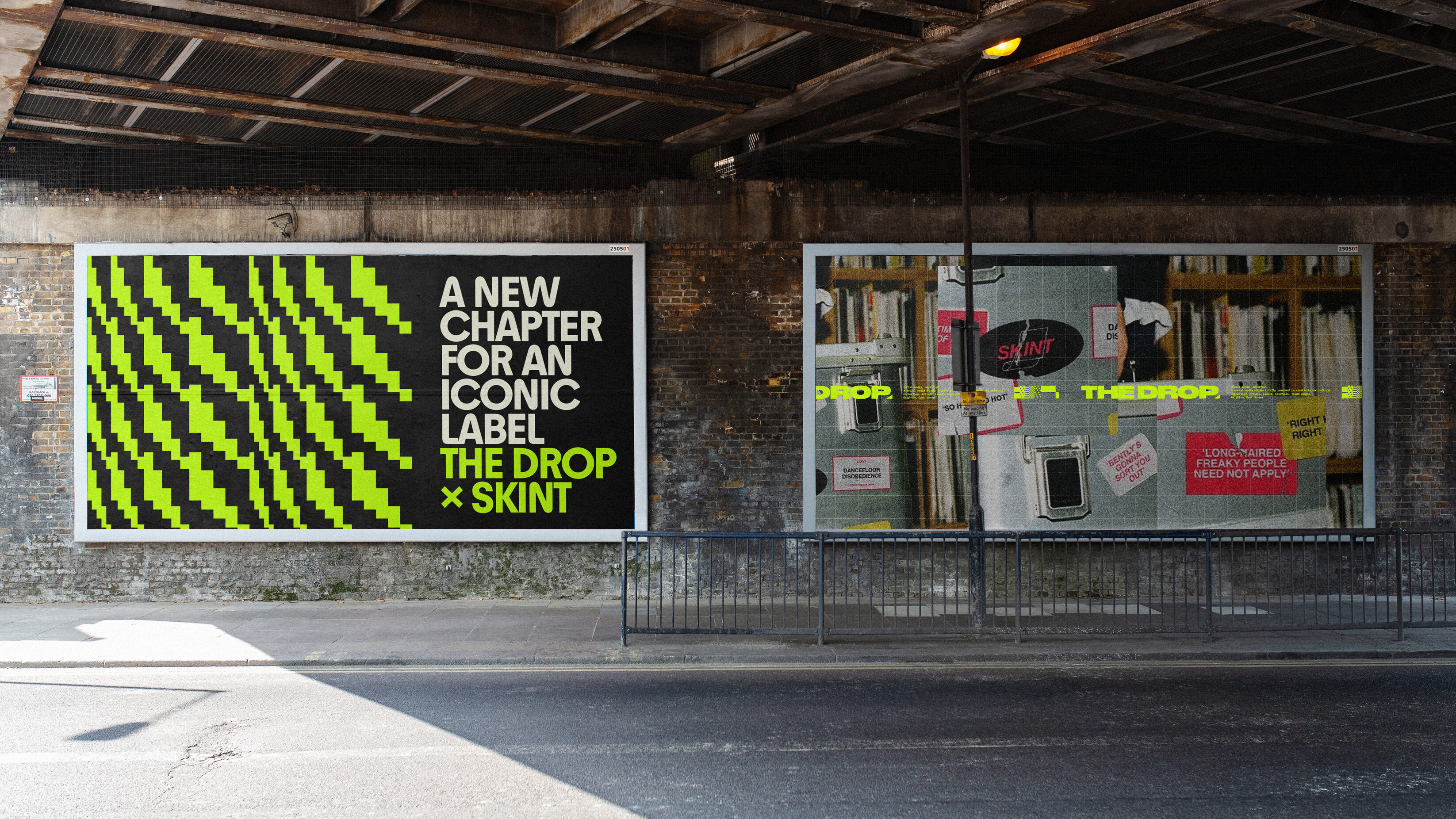 Two billboards under a bridge