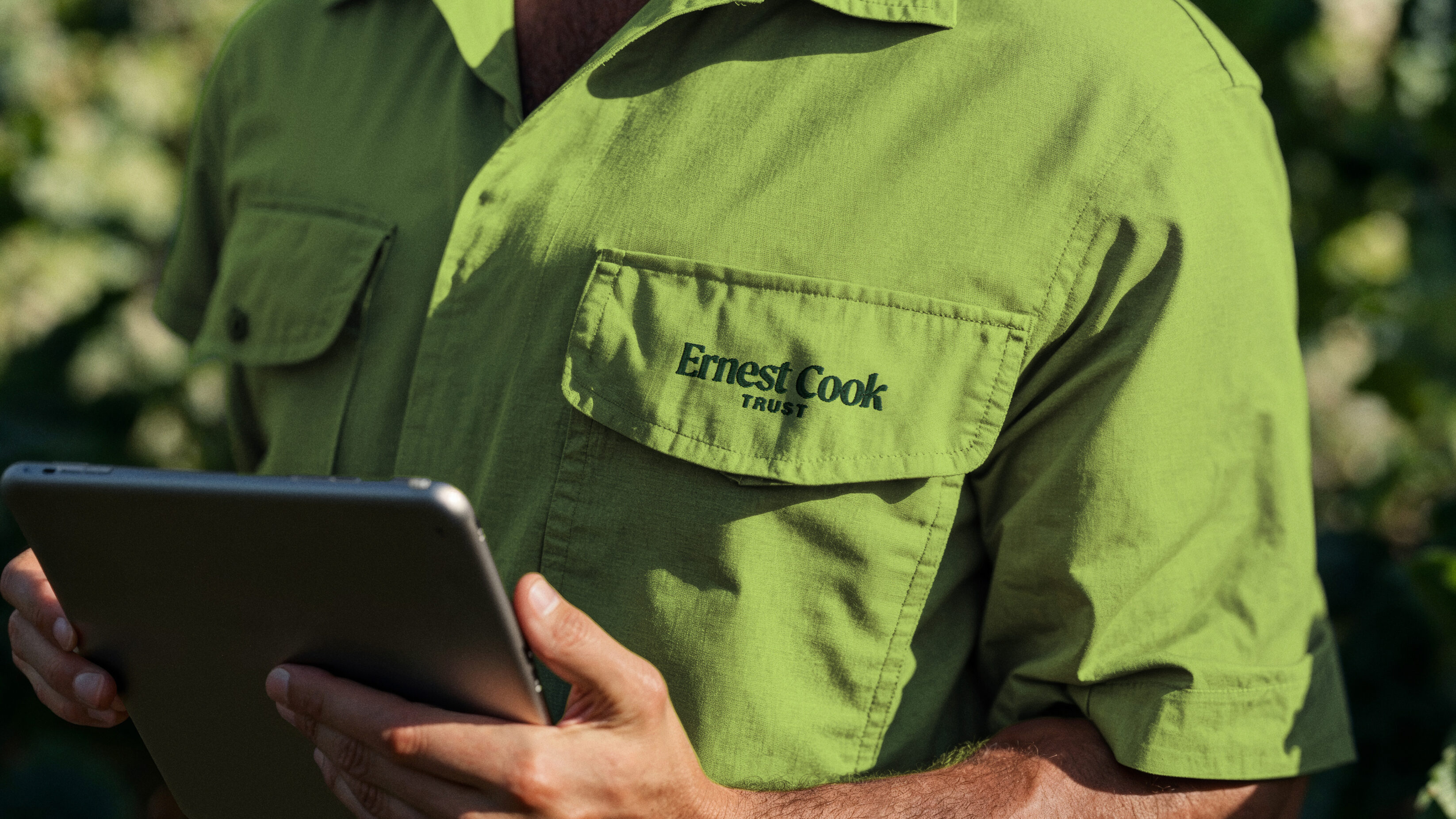 Ernest Cook Trust worker, with the logo embroidered on their uniform top