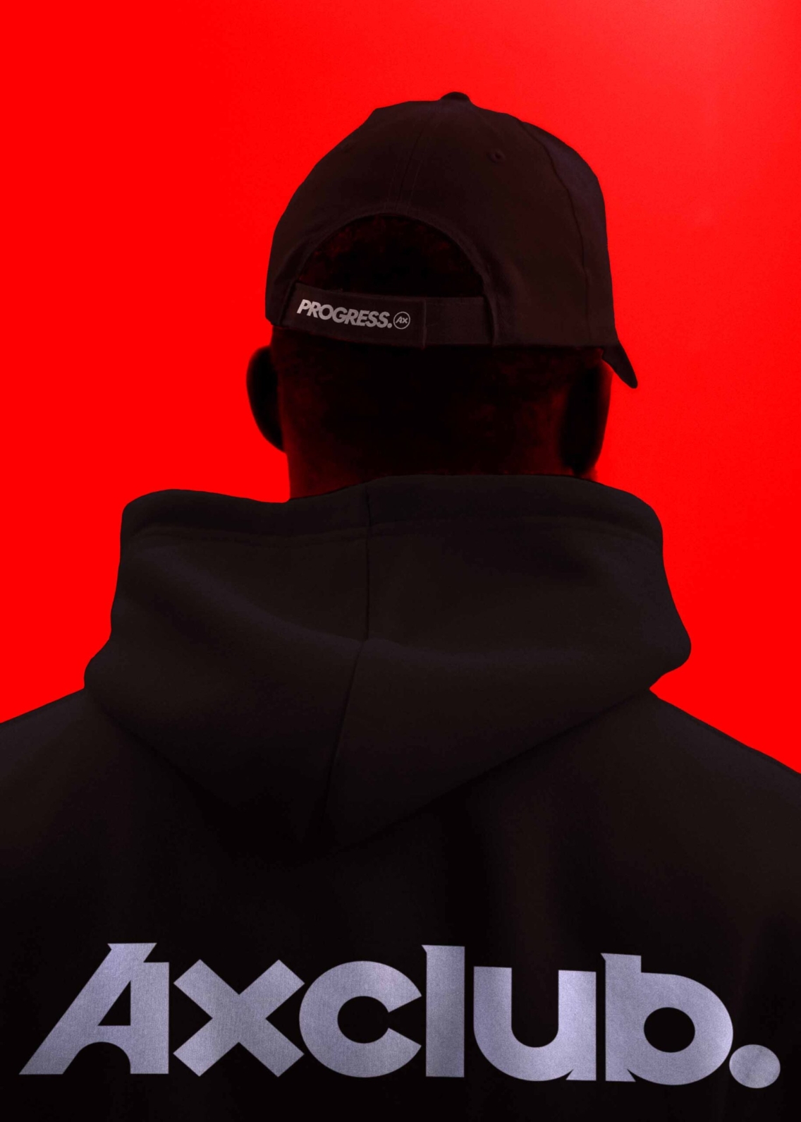 Man wearing an AxClub branded cap and hoody, with the AxClub logo on.